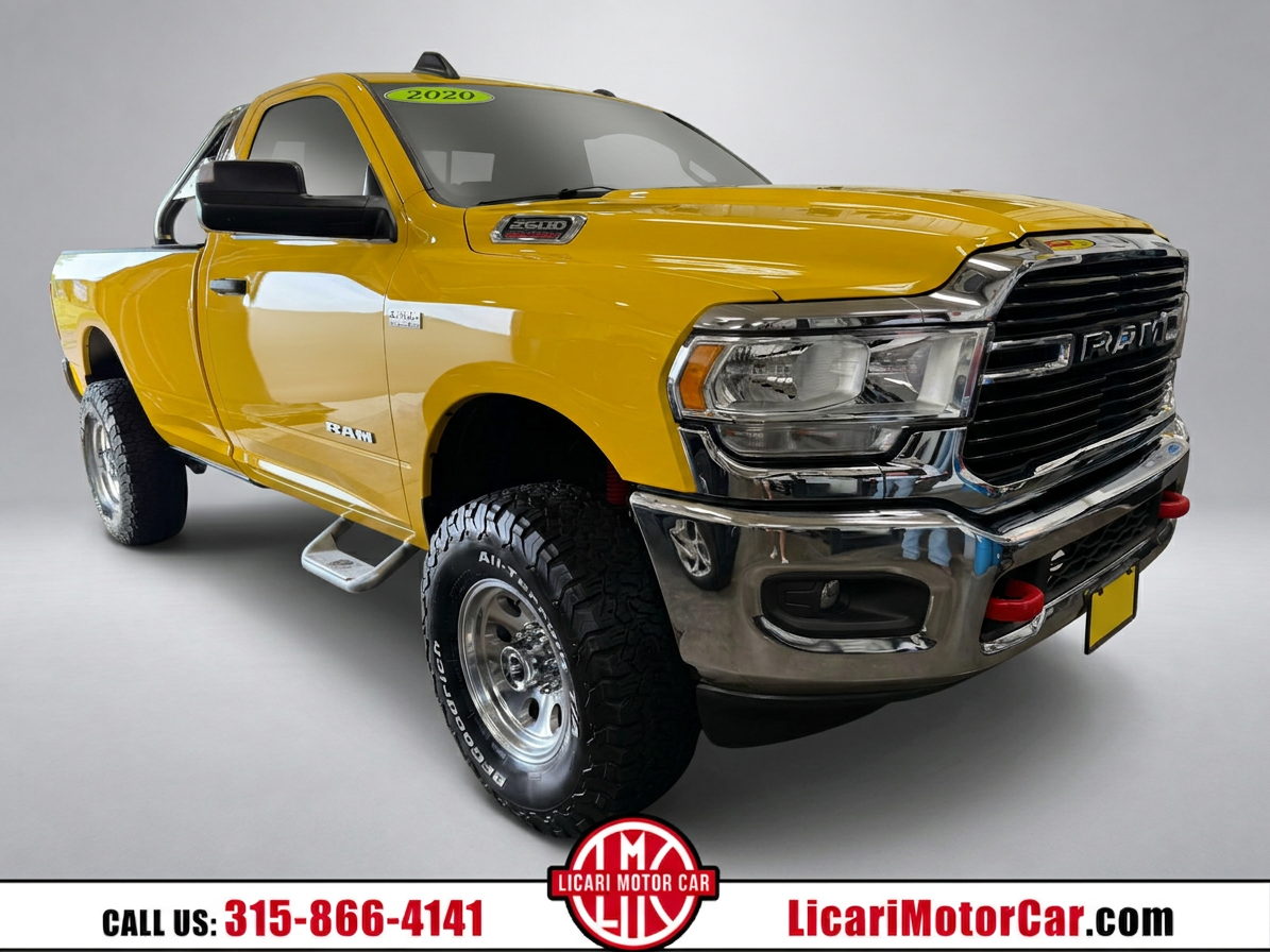 Same yellow RAM truck on a neutral studio background